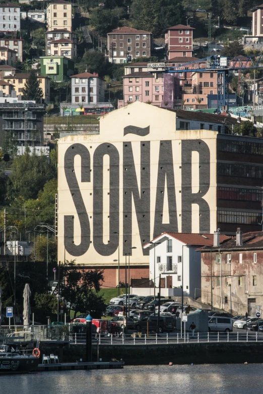 a tall sign above the water saying sonar