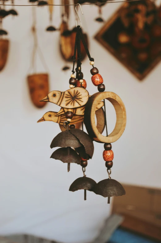 a wind chime that has an acorn decoration on it