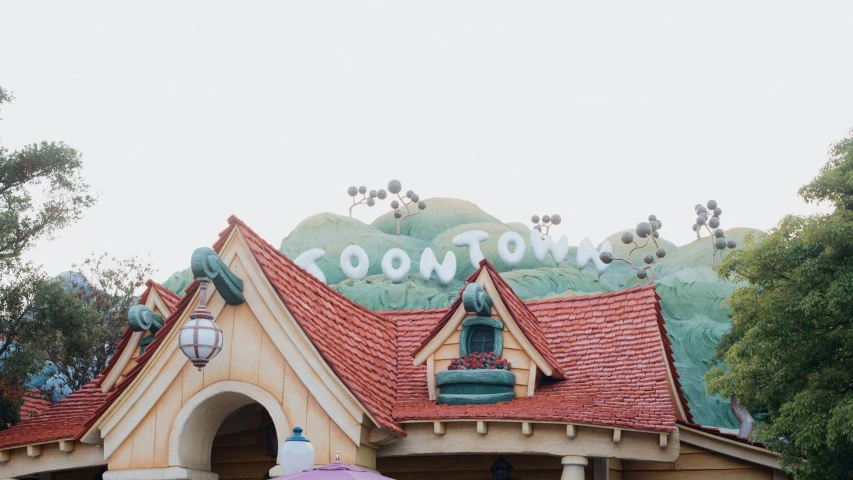 a picture of an amut park building with a purple umbrella