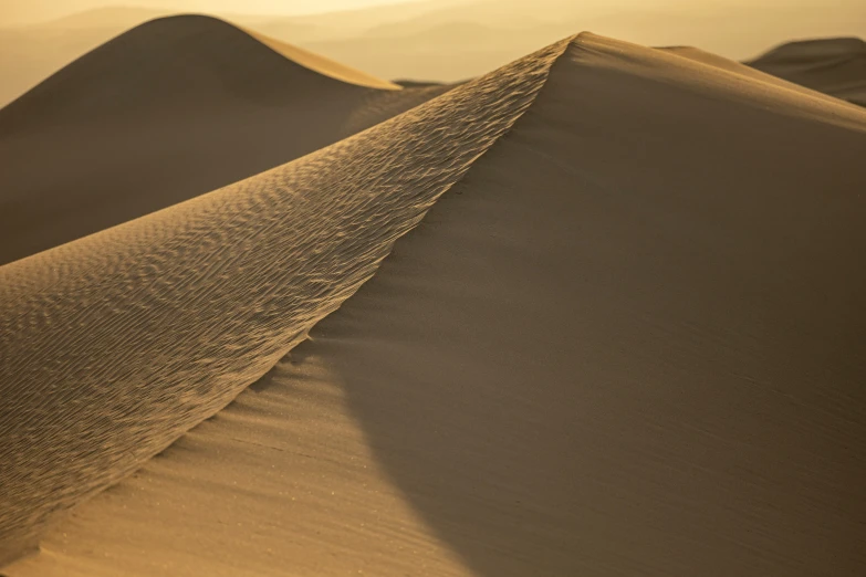 a very tall, thin dune in a desert