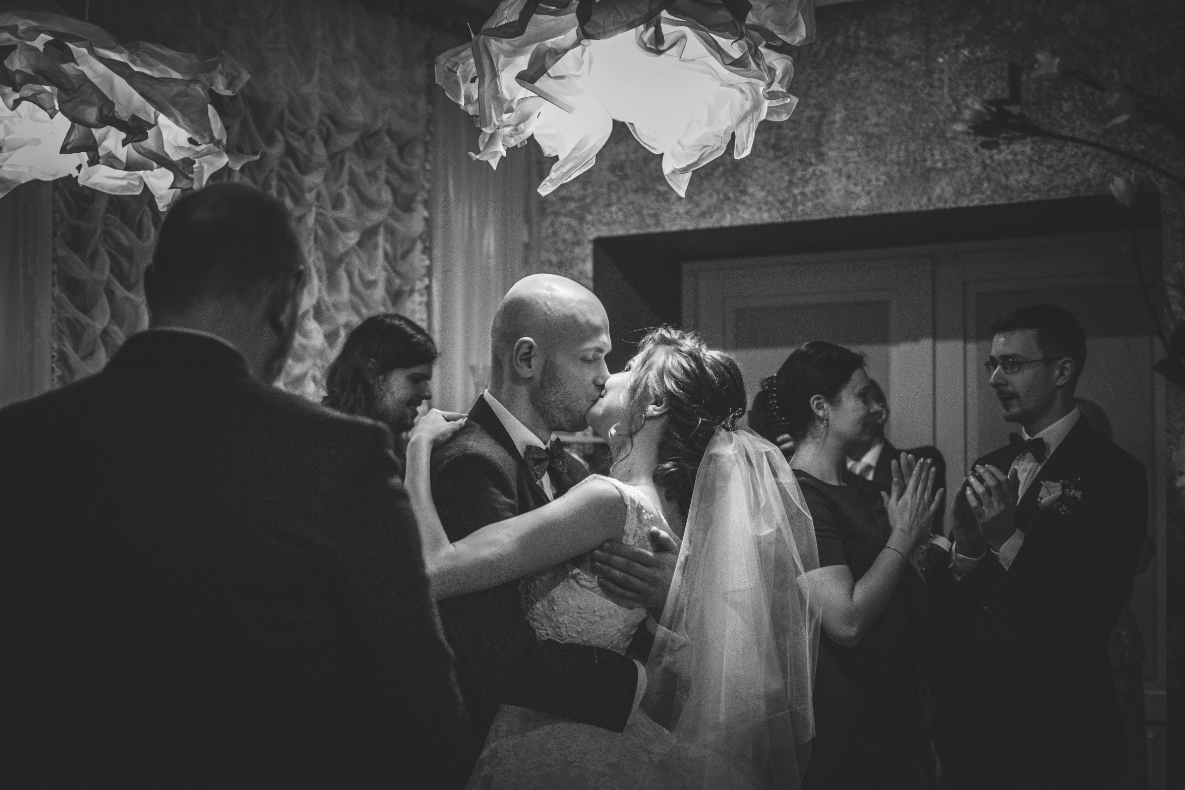 a couple is sharing their first dance