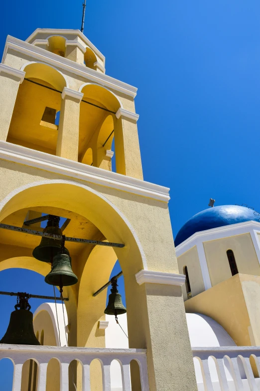 an old church with bells and two bell towers