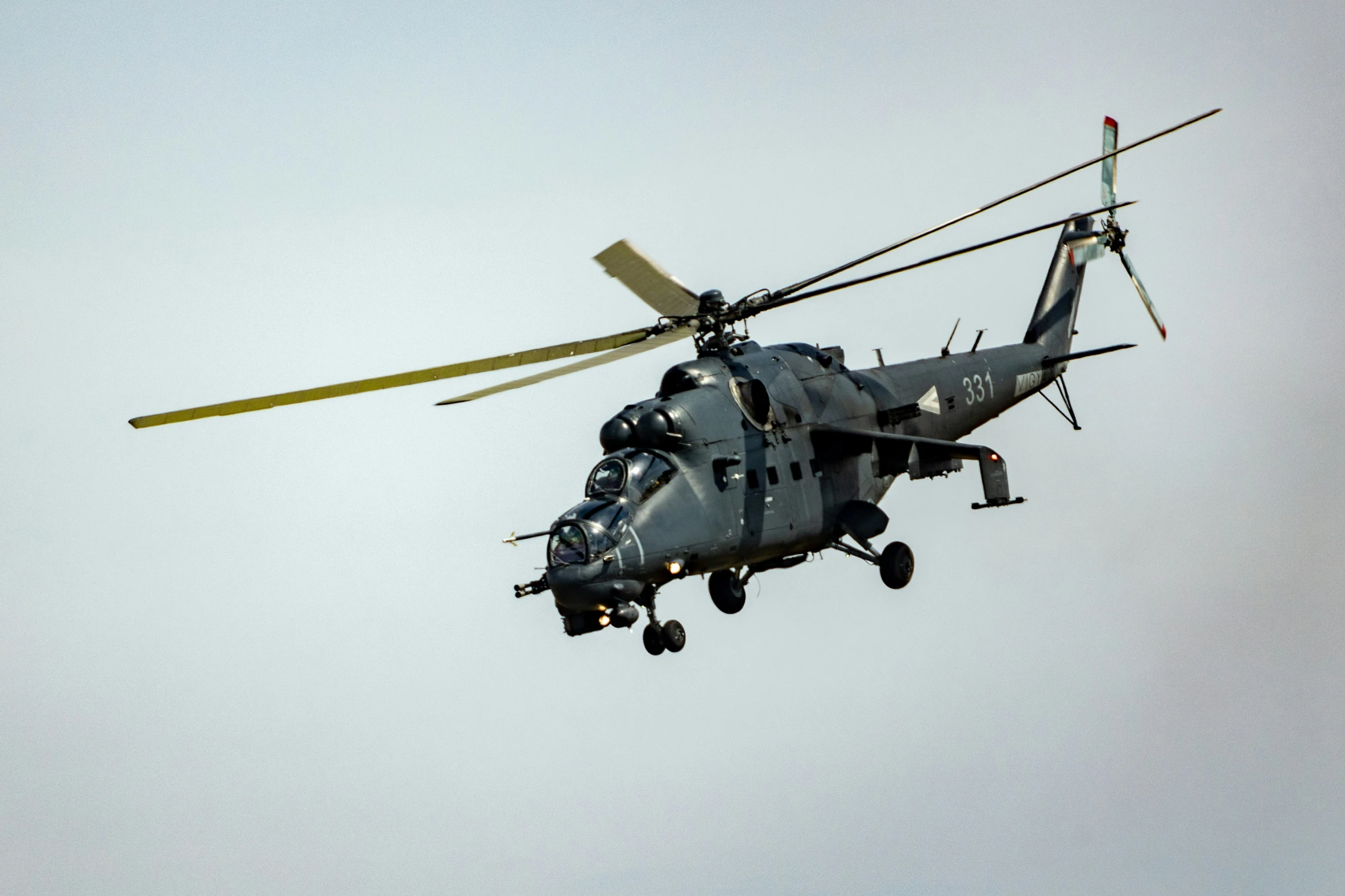 a helicopter with four propellers flying in the sky