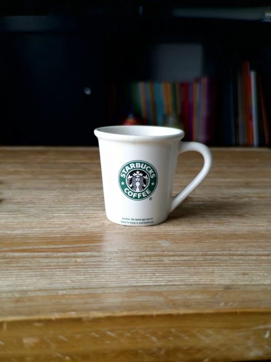 a starbucks cup sitting on top of a table