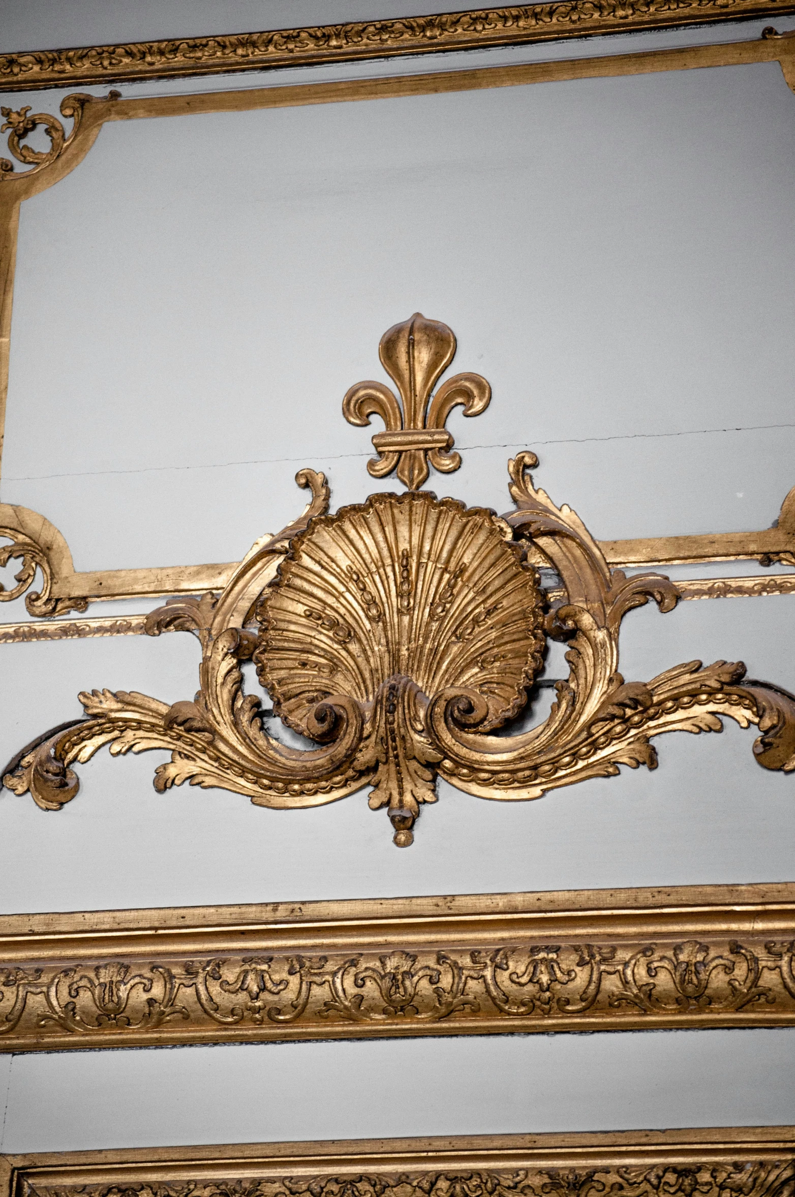 an old gold decorative frame and ornate carvings