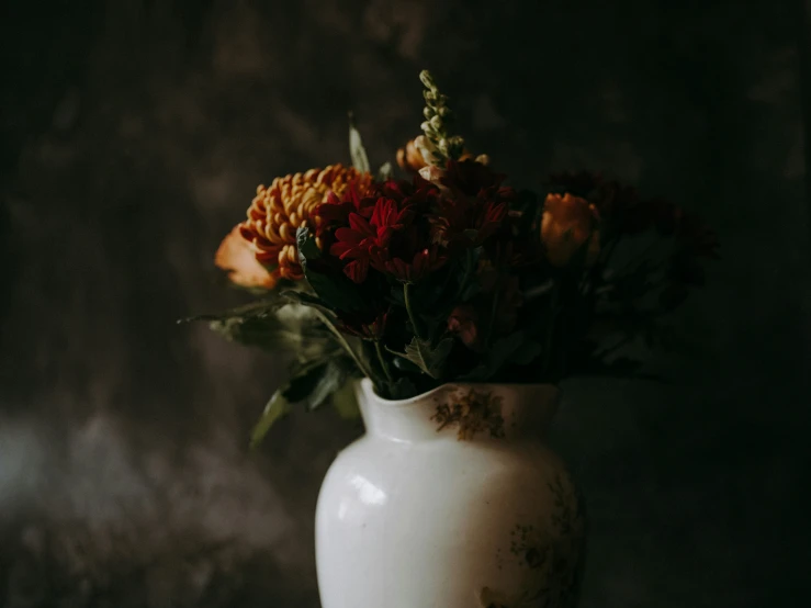 a vase filled with flowers on top of a table