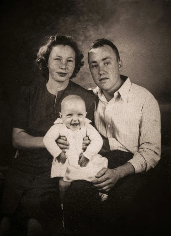 an old po with a picture of an adult and a baby, including a baby girl