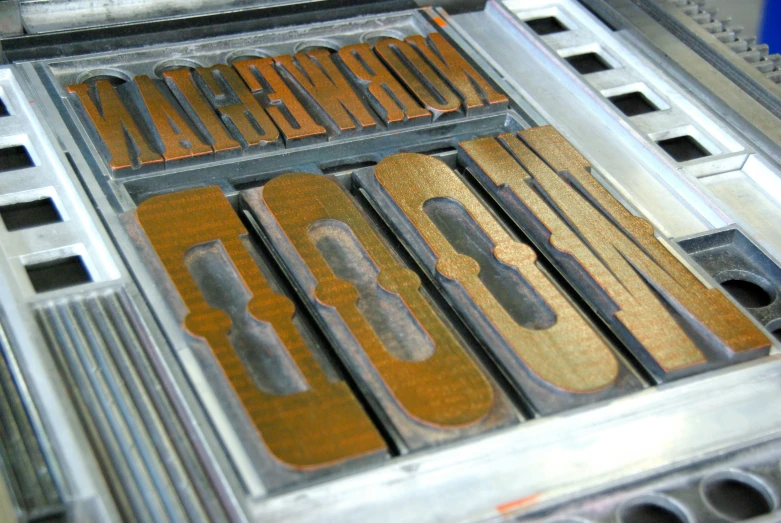 a metal structure with metal letters inside it