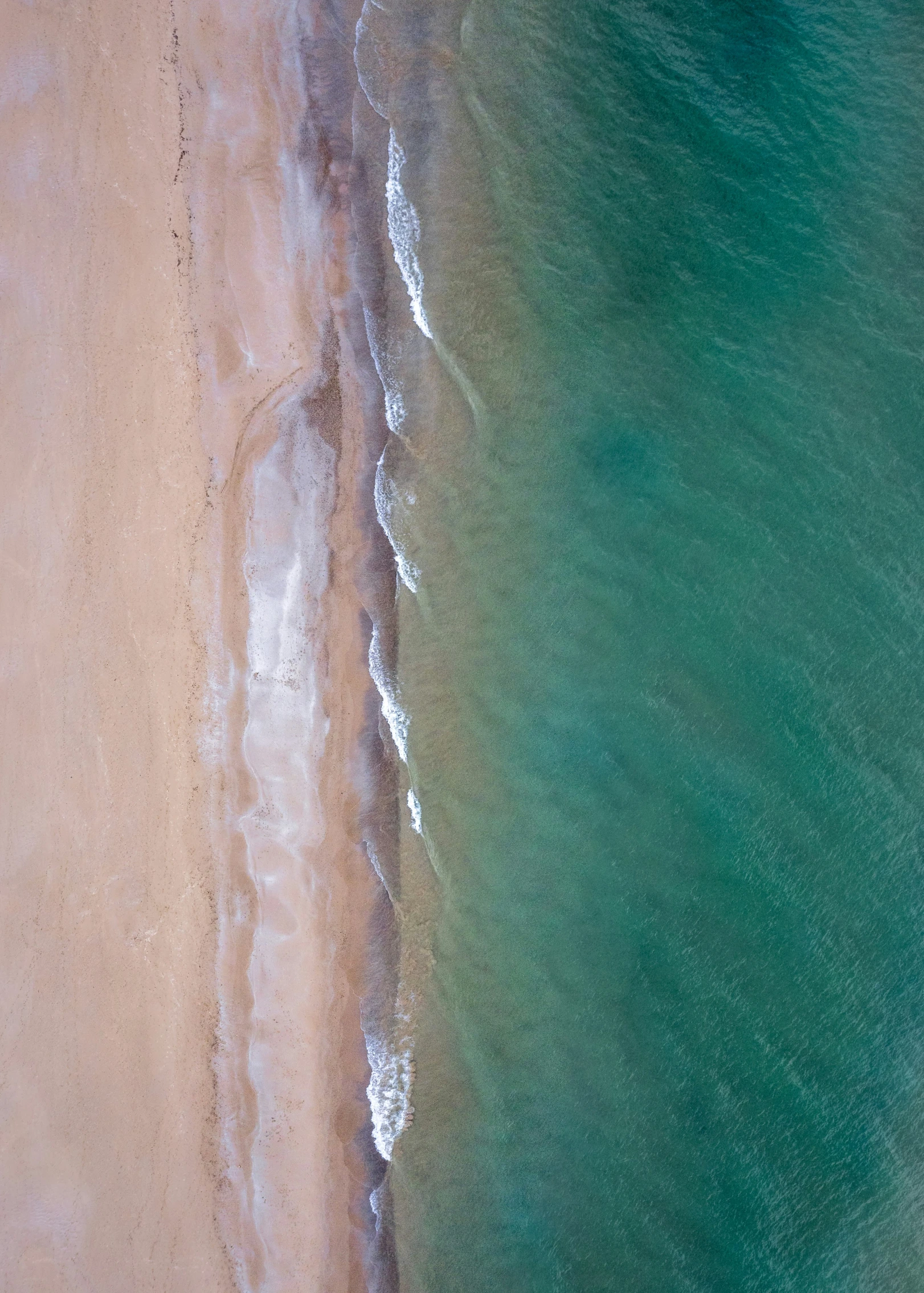 an aerial view of the sea and beach