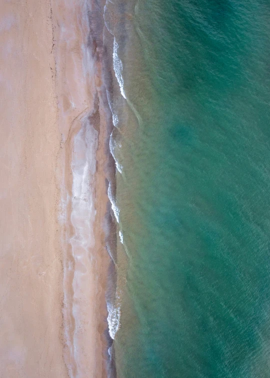 an aerial view of the sea and beach