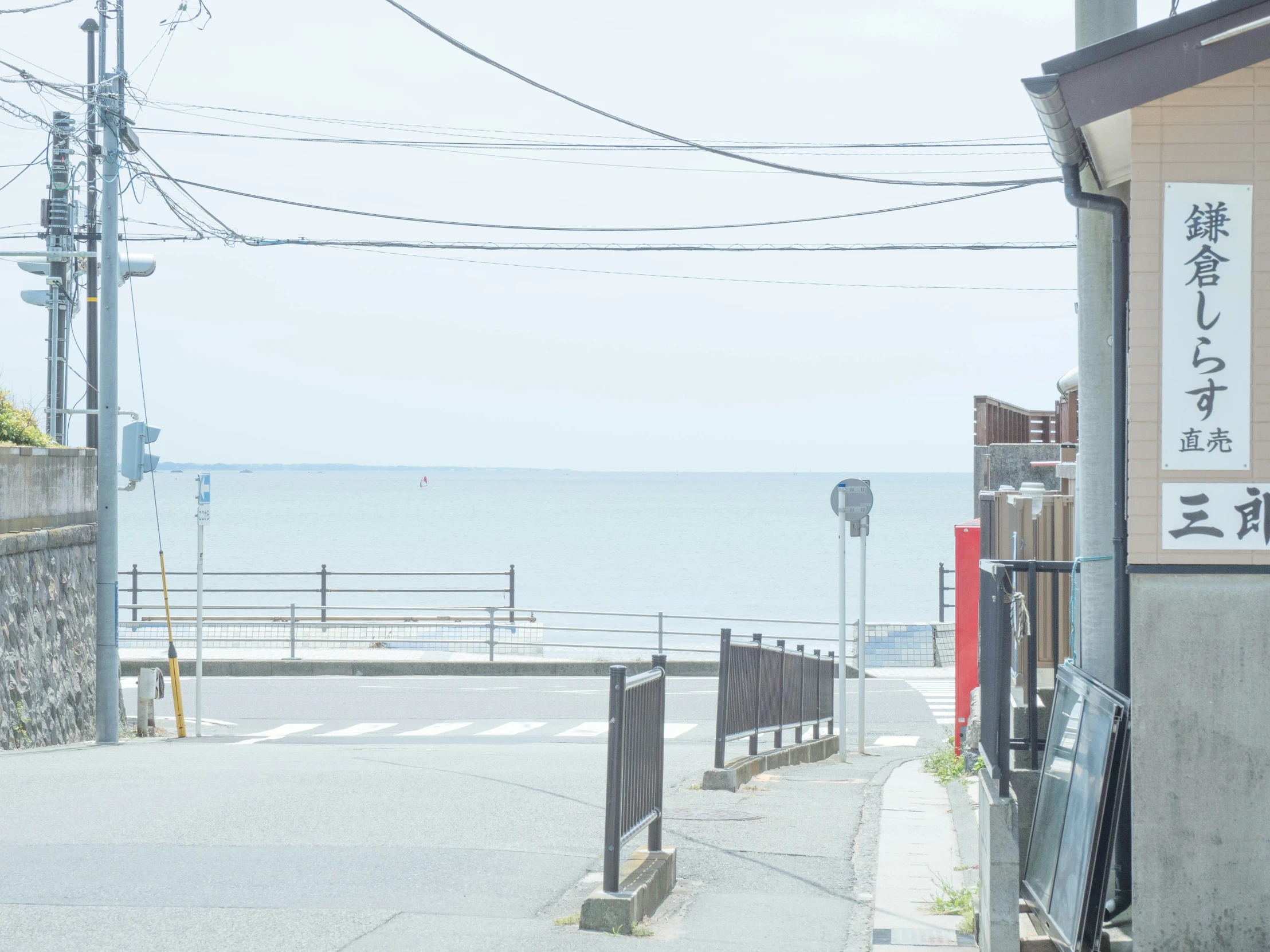 people walking down the street to the ocean