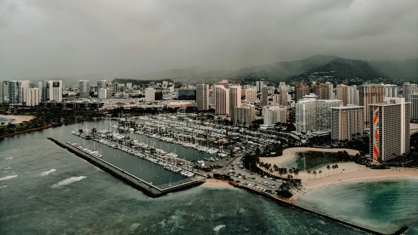 a city on the shore next to a body of water