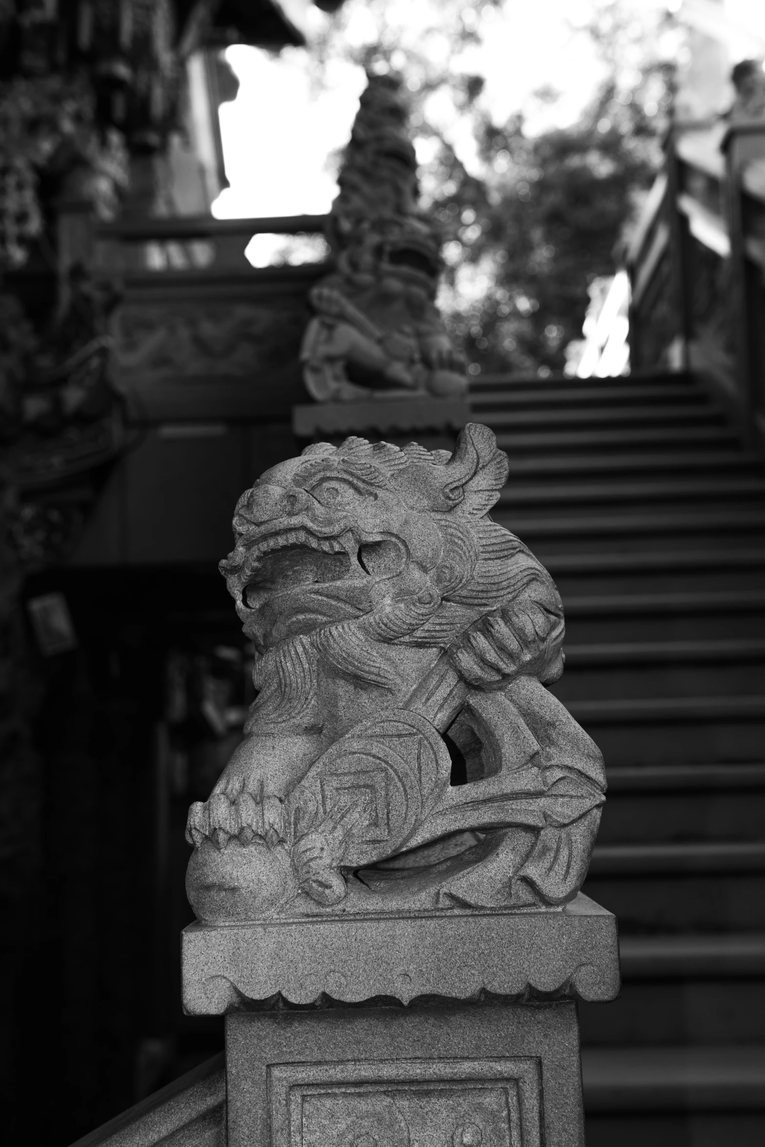 a close up of a stone statue on a stairway