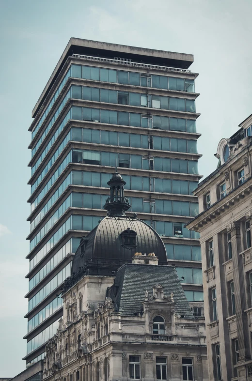 a building is seen behind another one in a large city