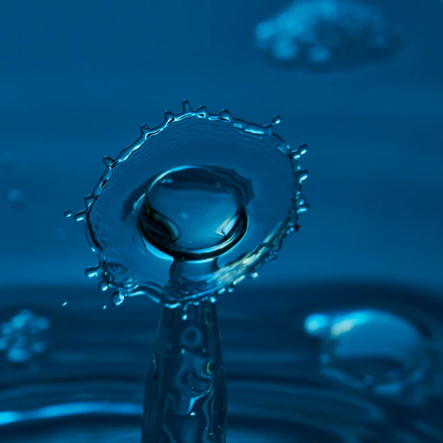 water droplets are reflected in blue water