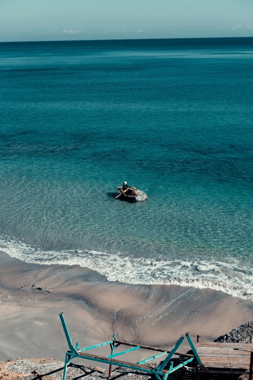 a boat on top of an open water filled sea