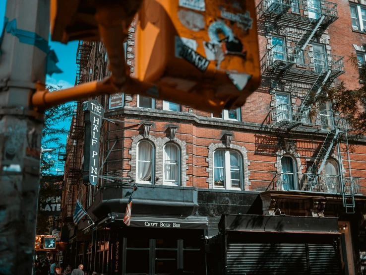 an intersection is covered in graffiti and a building has many windows