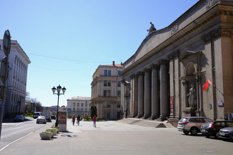 a city street lined with tall, ornate buildings