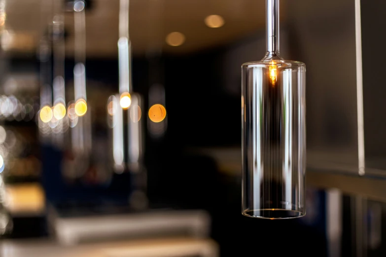 a hanging wine glass next to a bar