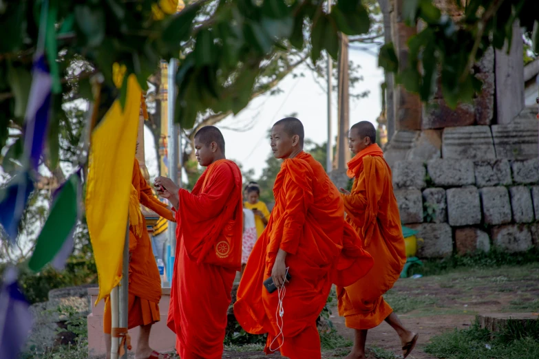monks walk in the courtyard of a temple