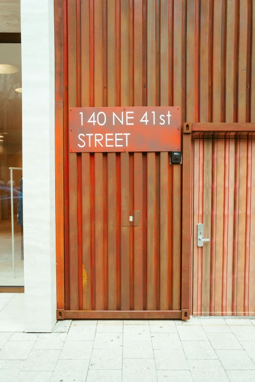 a sign reads 480 ne 41 street in front of an open door