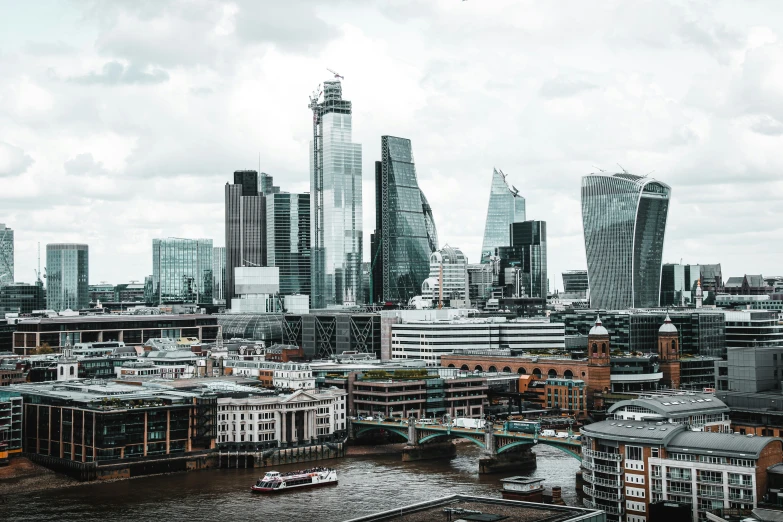 a wide angle view of some tall buildings and the city skyline