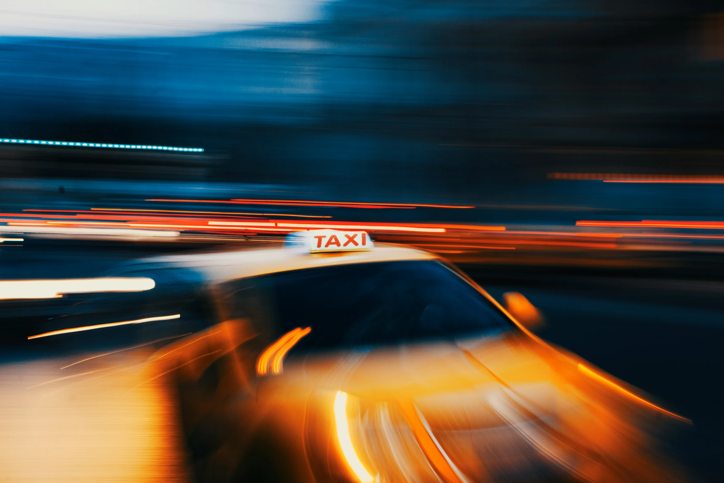 a blurred taxi car at the speed of some traffic