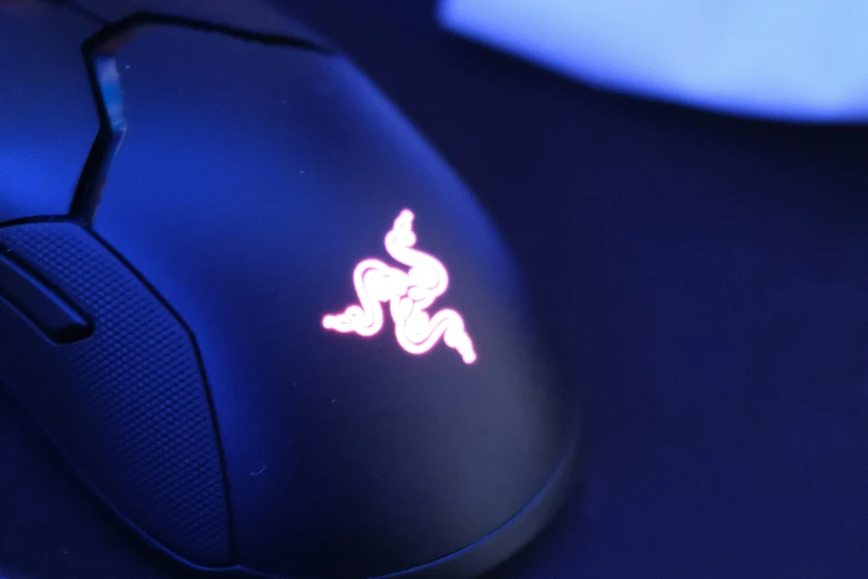 there is a computer mouse with an emblem