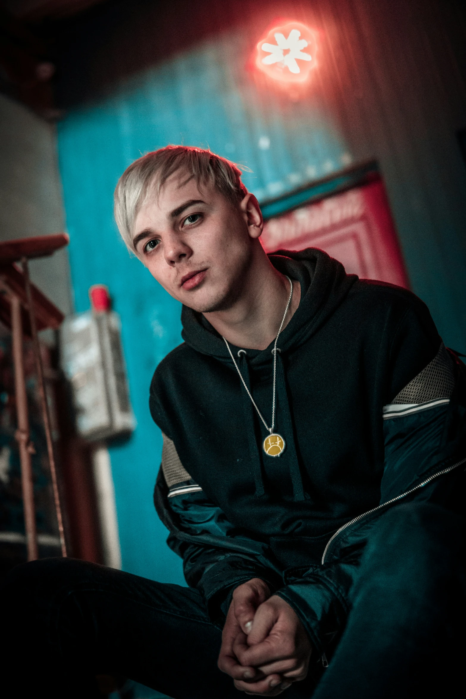 a man sitting in a room with a very colorful wall