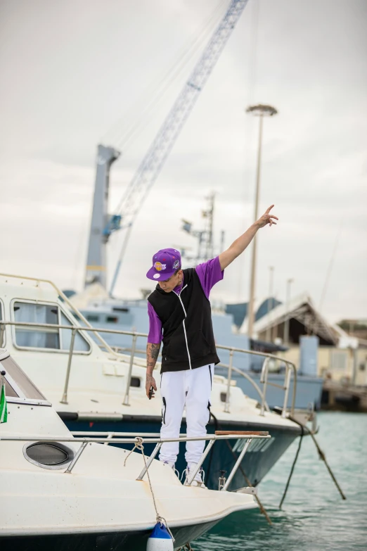 a man stands on the deck of a boat