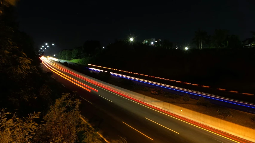 cars passing by on a highway at night