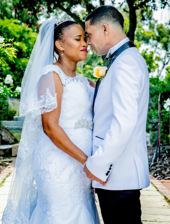 bride and groom holding each other close together