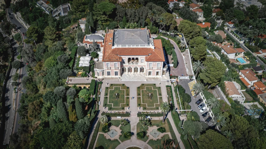 a beautiful old mansion surrounded by lots of trees