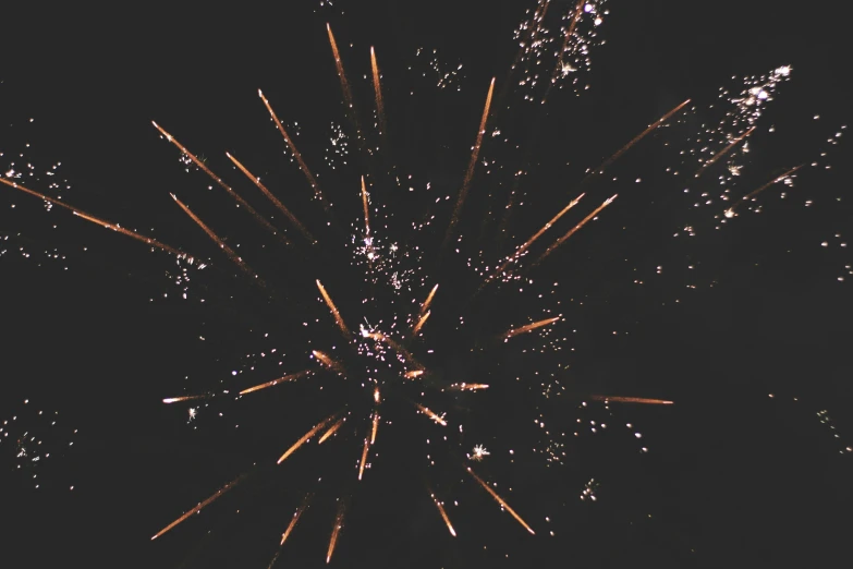 an abstract po of fireworks with a black background