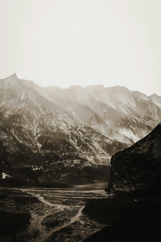 a mountain covered in lots of snow and rocks