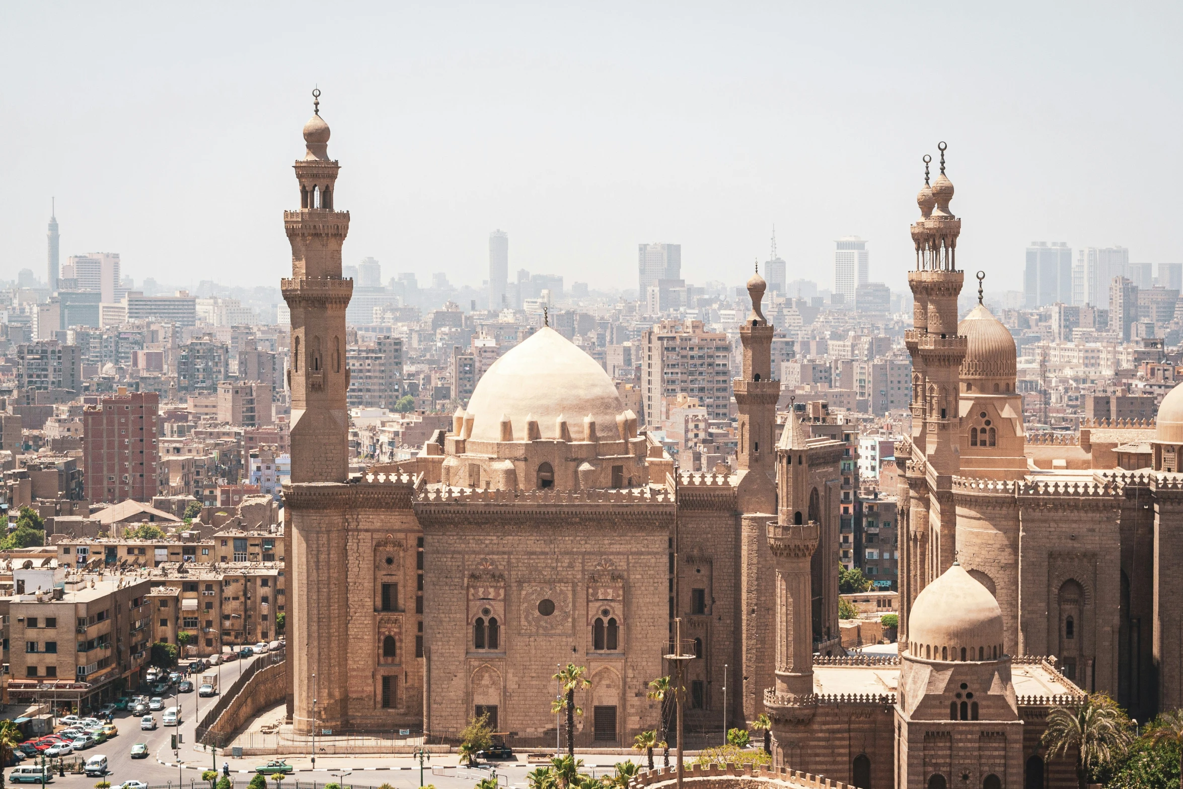 an old cityscape with an oriental style mosque and minalis