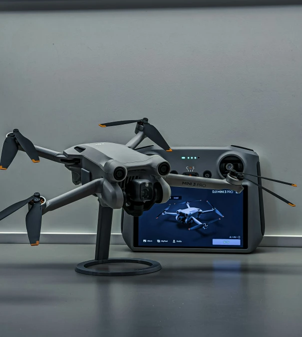an image of a camera attached to a small drone