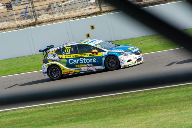 a small car is on the track at a turn