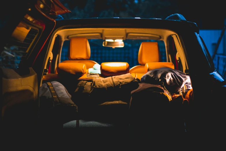 a person sleeping in the back of a pick up truck