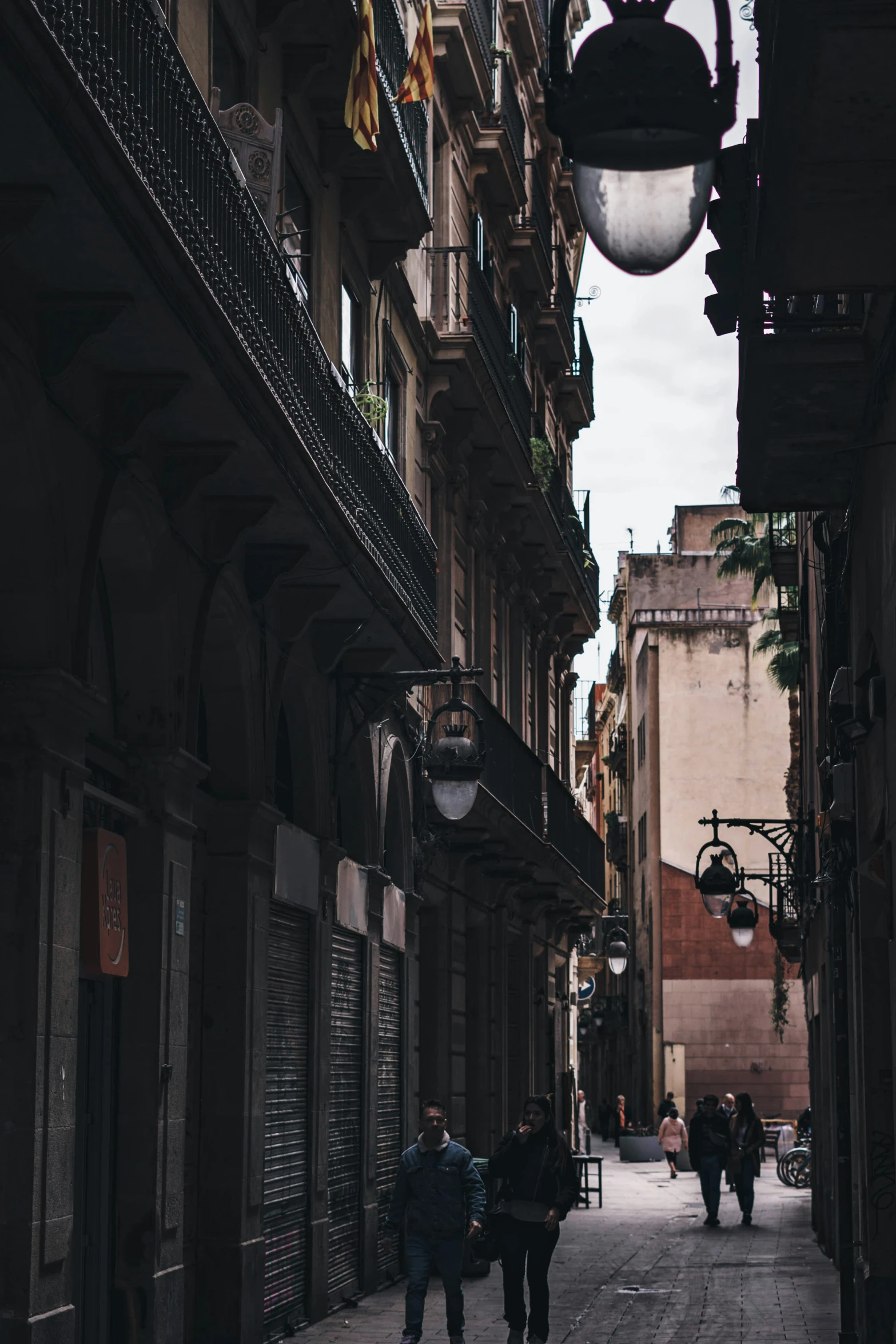 a narrow city street filled with people