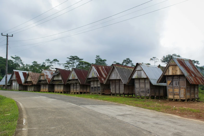 a row of houses sitting in front of the road
