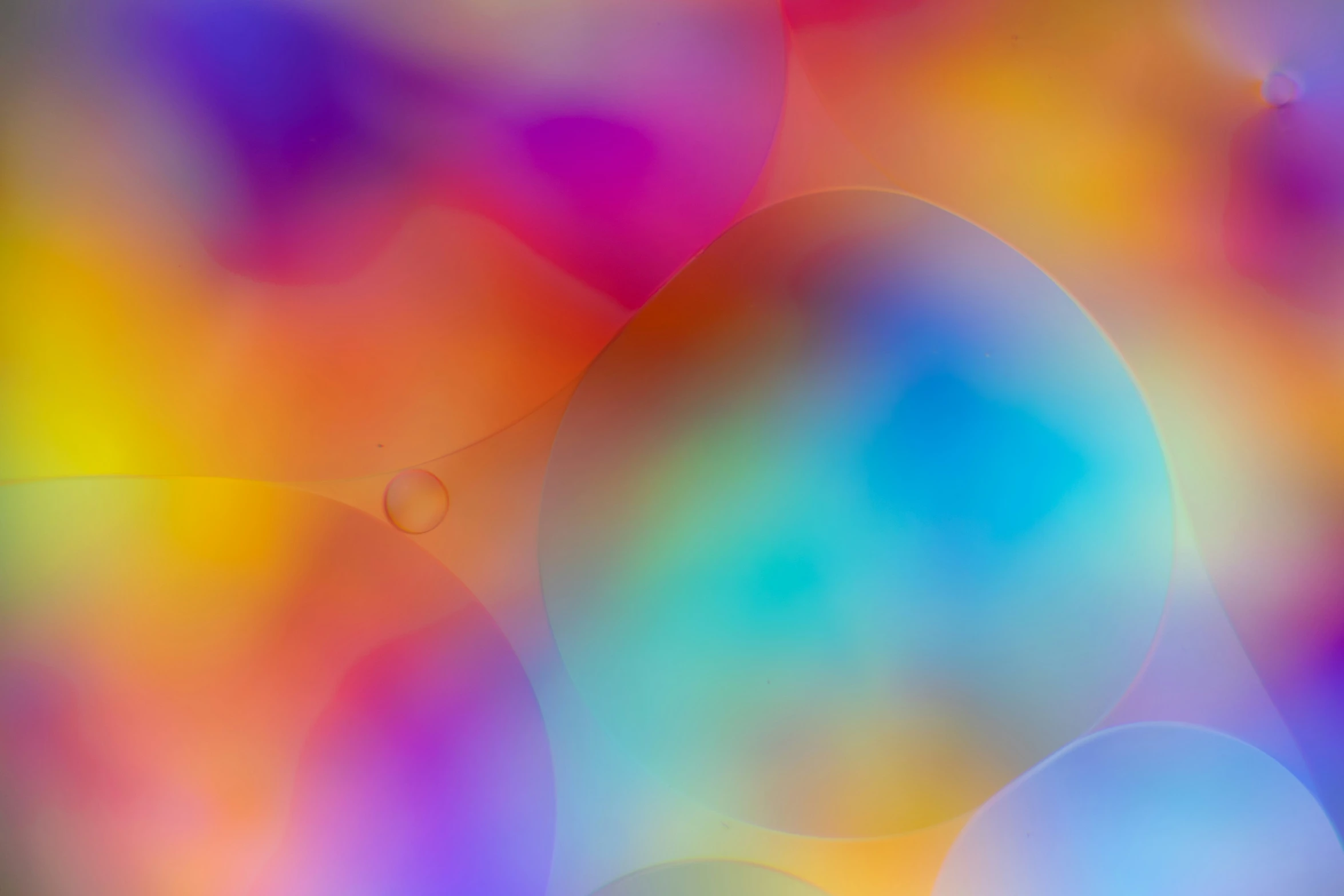 a background with blue and yellow bubbles in it