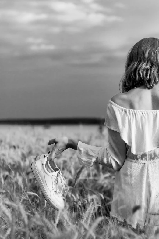 two children are standing in tall grass