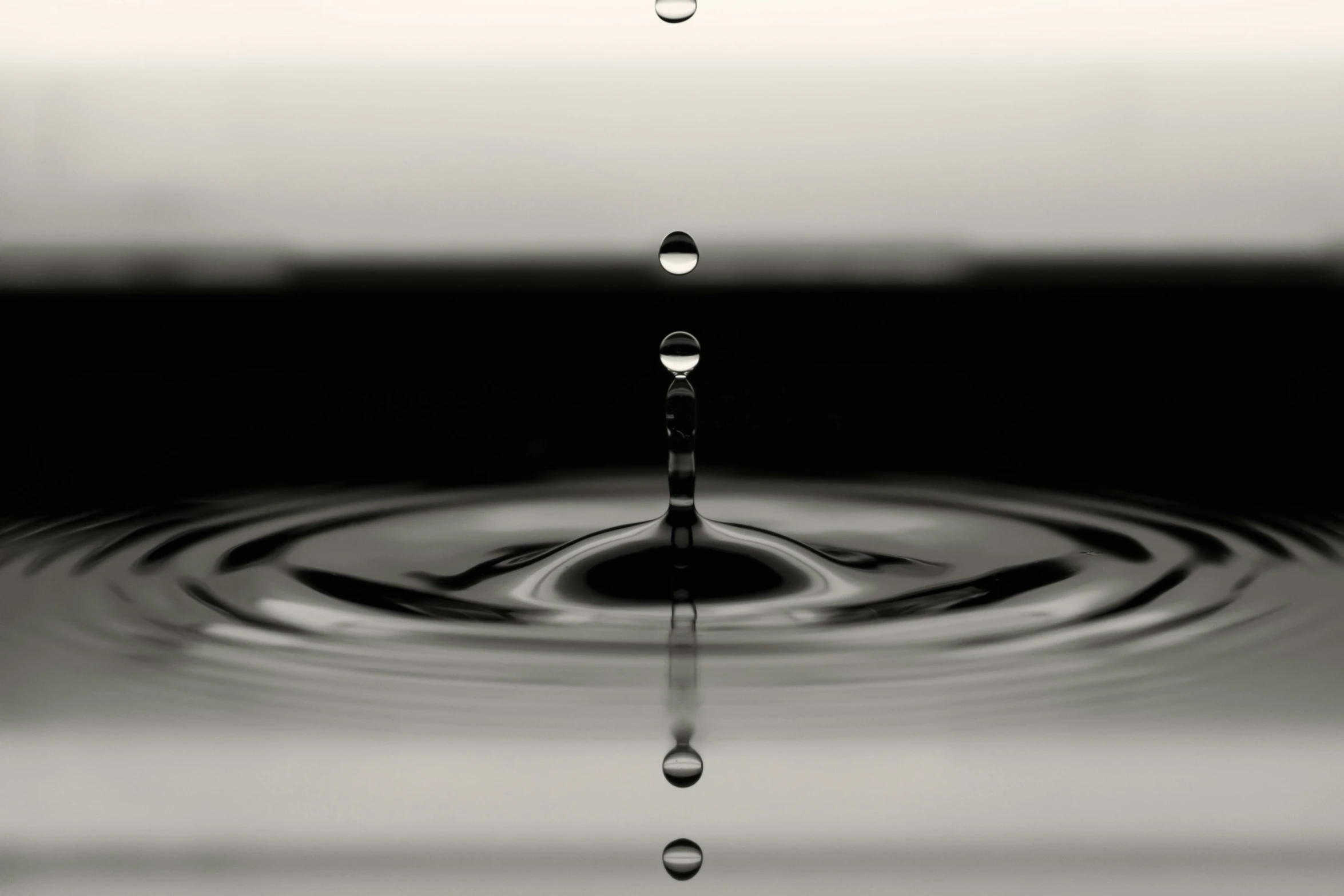 a water drop with water droplets coming out