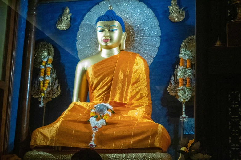 a buddha statue in the middle of a room