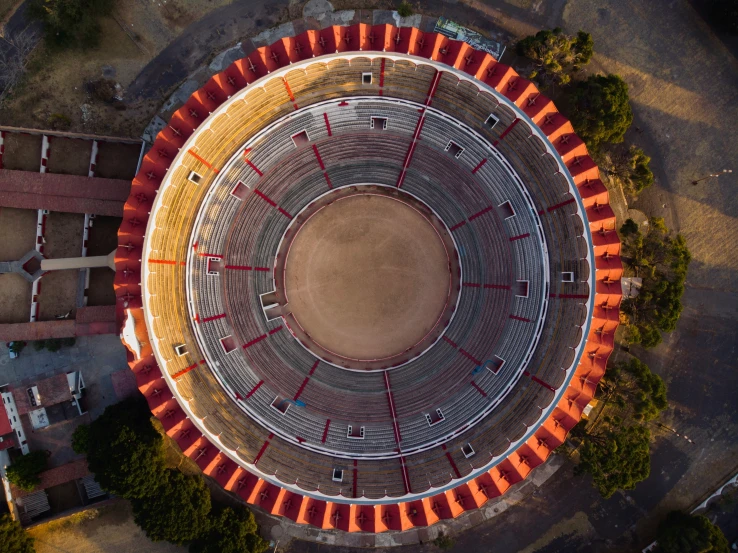 an aerial view of a large round field with many seats on it