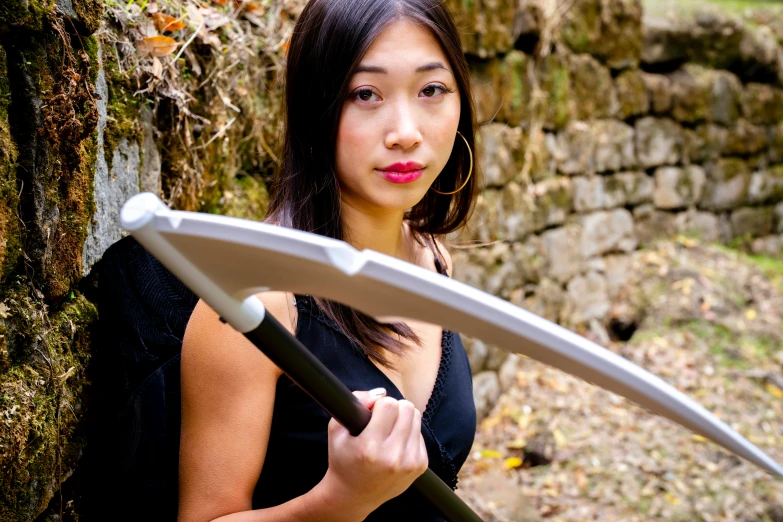 a woman with a sword in the park