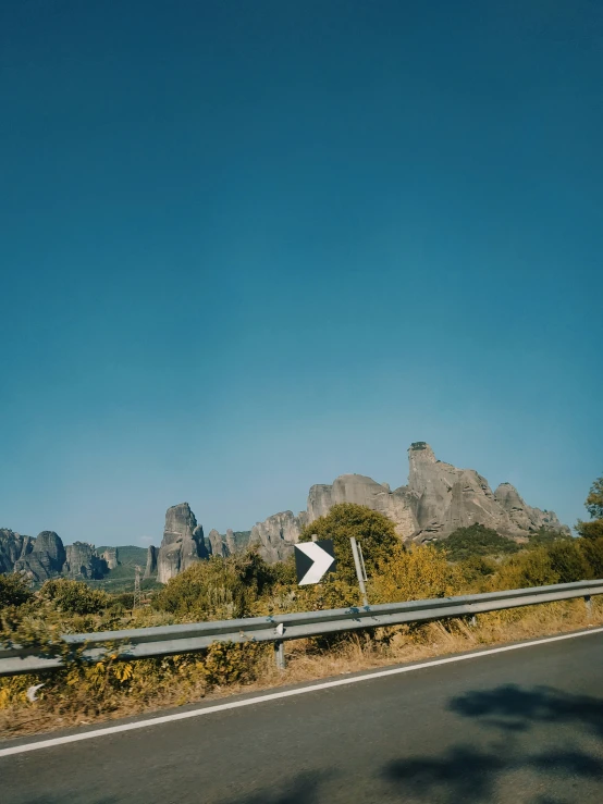 a road sign sitting on the side of a road