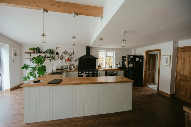 a kitchen that has an island in the middle