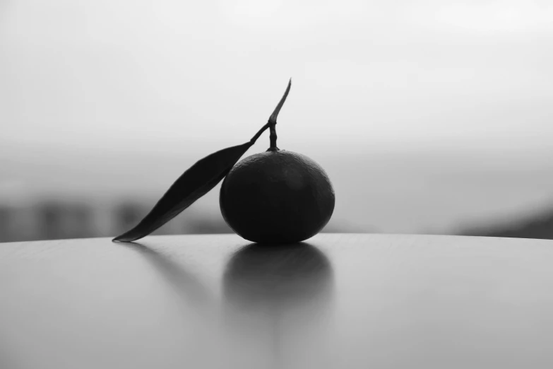 a orange sitting on top of a table